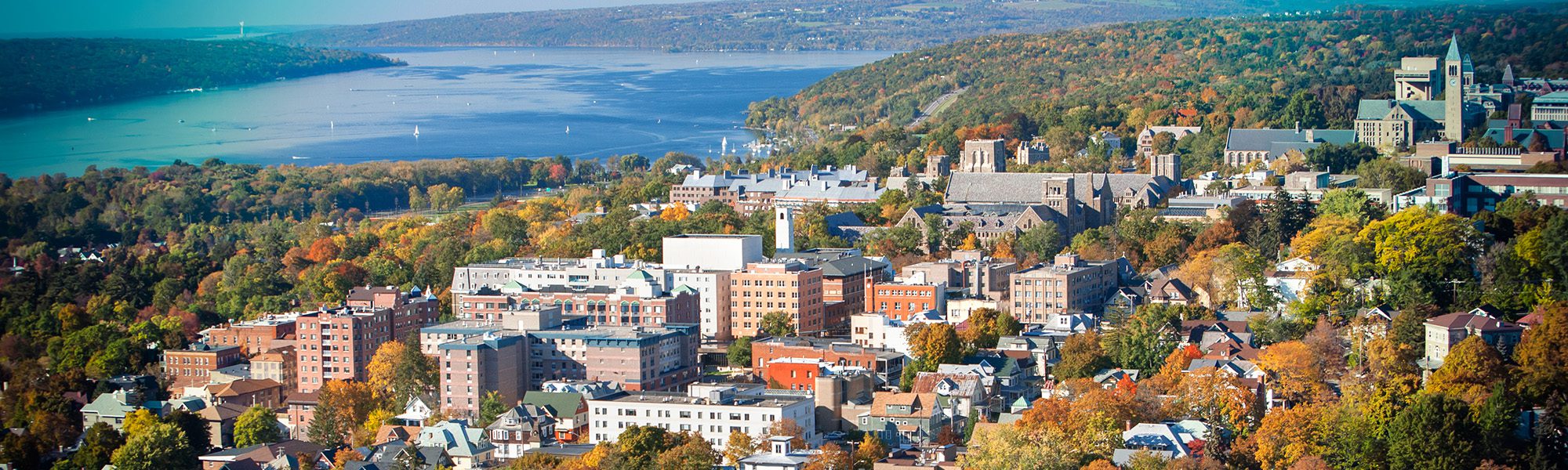 An aerial view in fall of central campus with Cayuga Lake in the background.