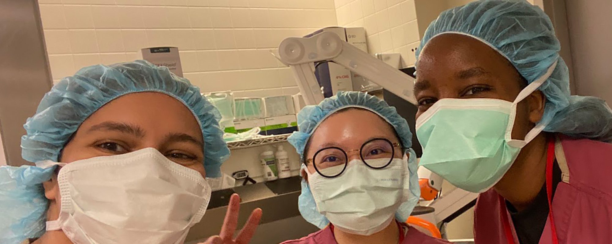 Ph.D. graduate students wearing scrubs at Weill Cornell Medicine WCM summer clinical immersion.