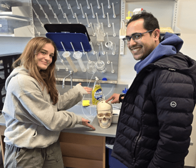 MEng students use their intracranial pressure simulation model to verify performance of their sensor in Tang Hall.