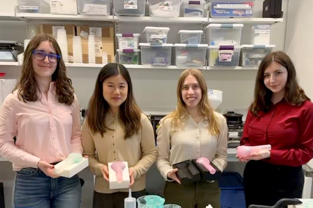 Slavett (right) presenting alongside her MEng project team after completing their final semester in the program.