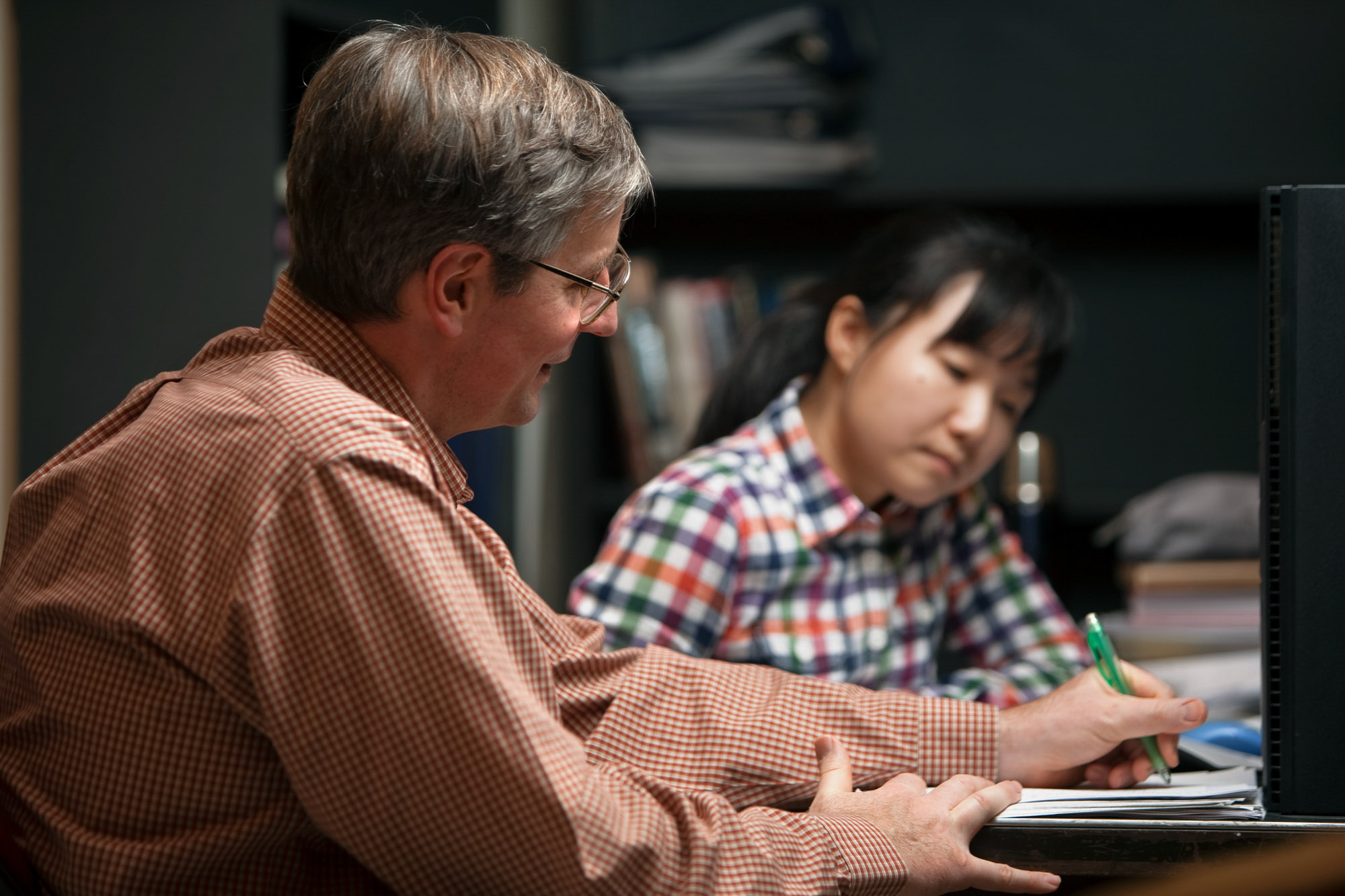 professor Donald Koch talking with a graduate student in his office