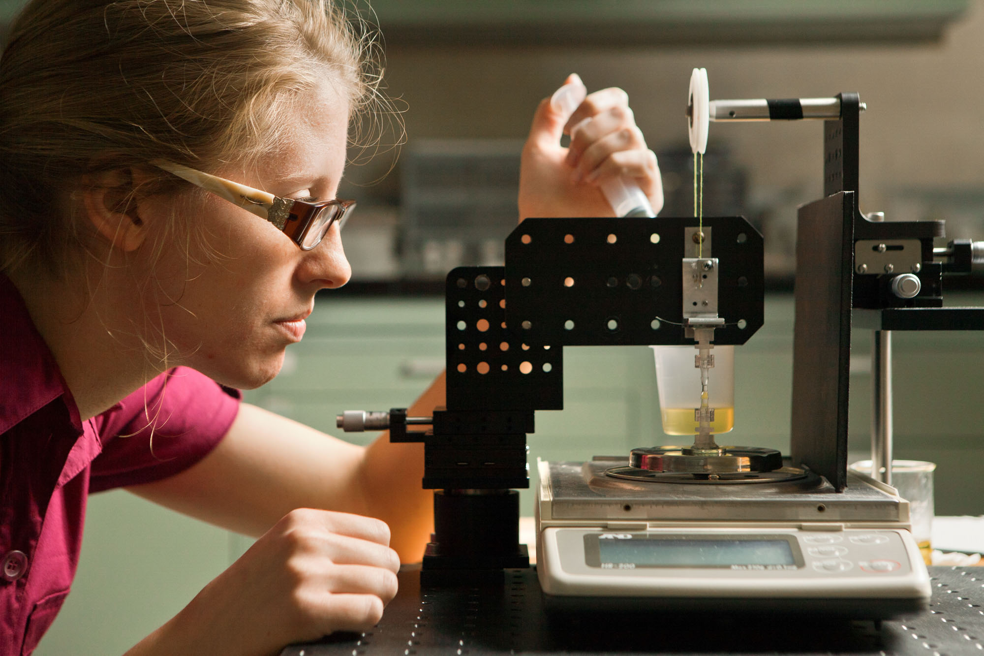 Student working on an experiment in a chemical and biomolecular engineering lab