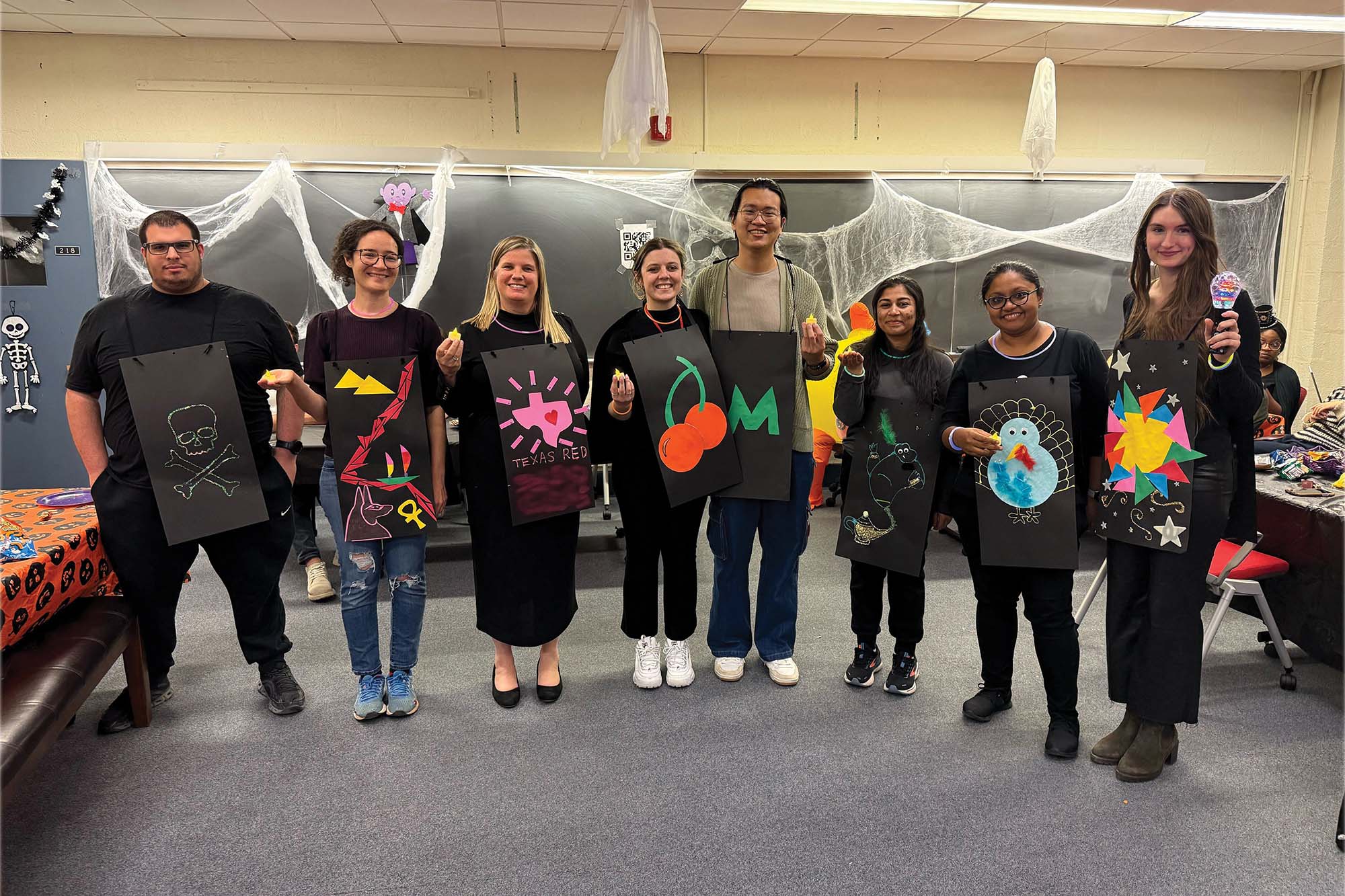 Susan Daniel and graduate student members of Chegsa pose wearing their group Halloween costume.