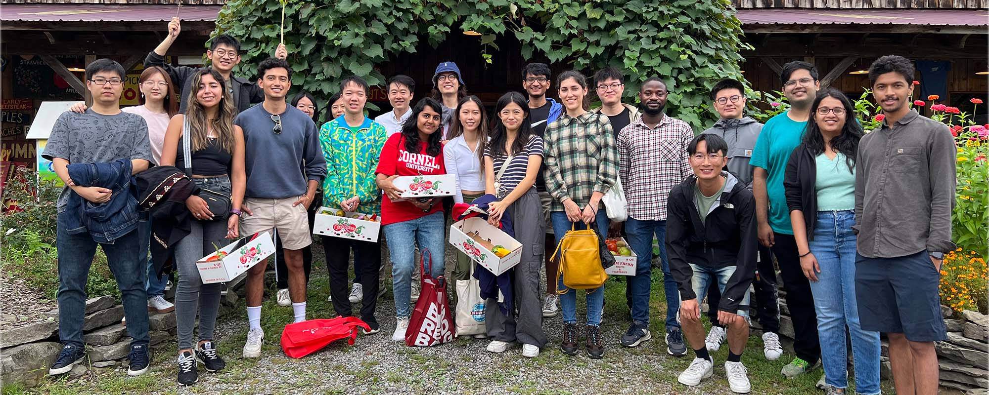 Students stand together at Indian Creek Farms for an apple picking event hosted by CBE Women.
