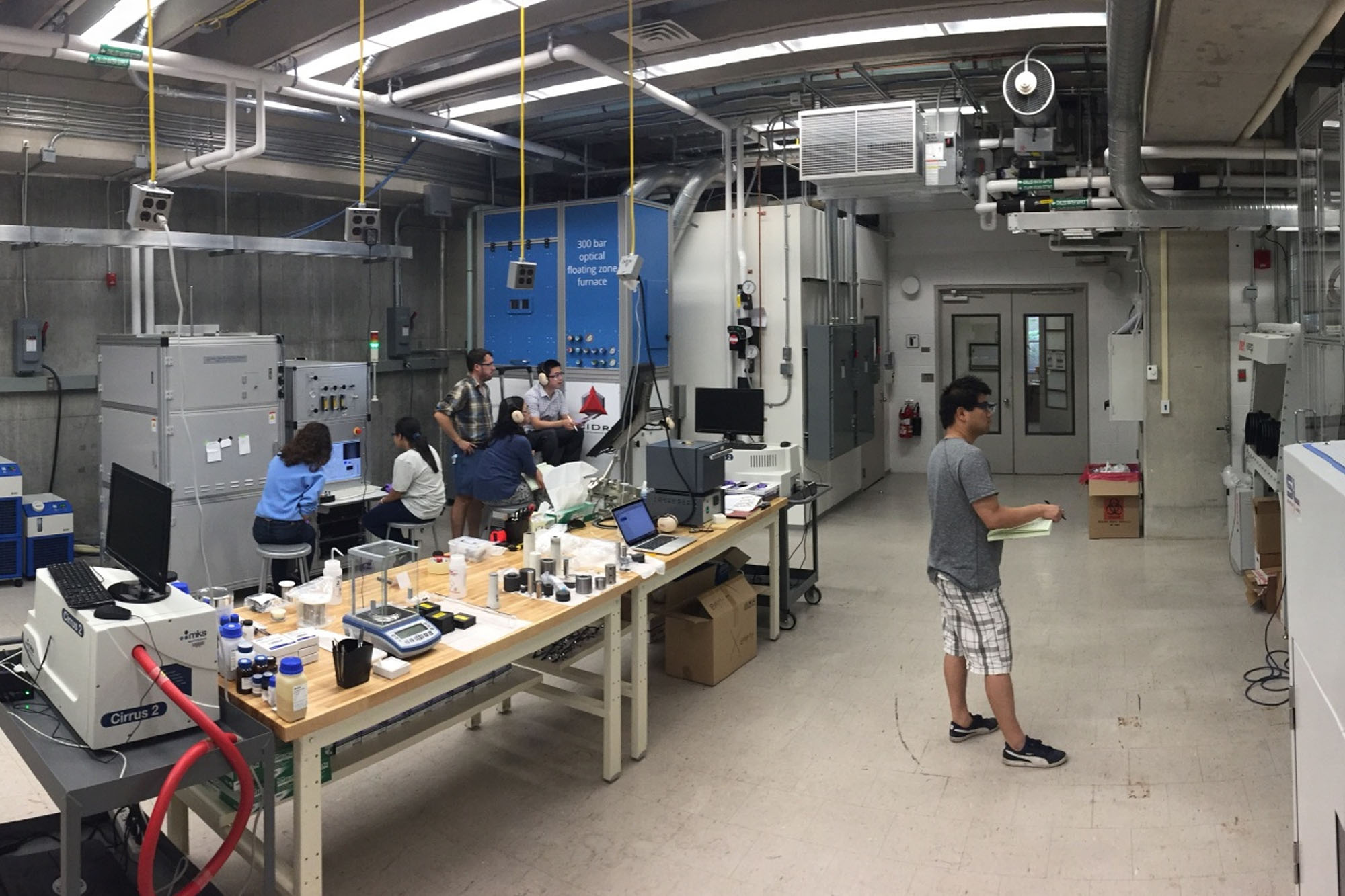 Students working with equipment in the crystal growth facility.