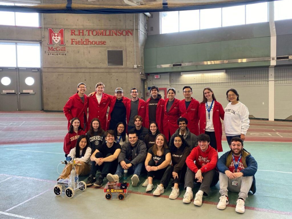 ChemE car undergraduate team standing together at 2023 regionals at McGill University.