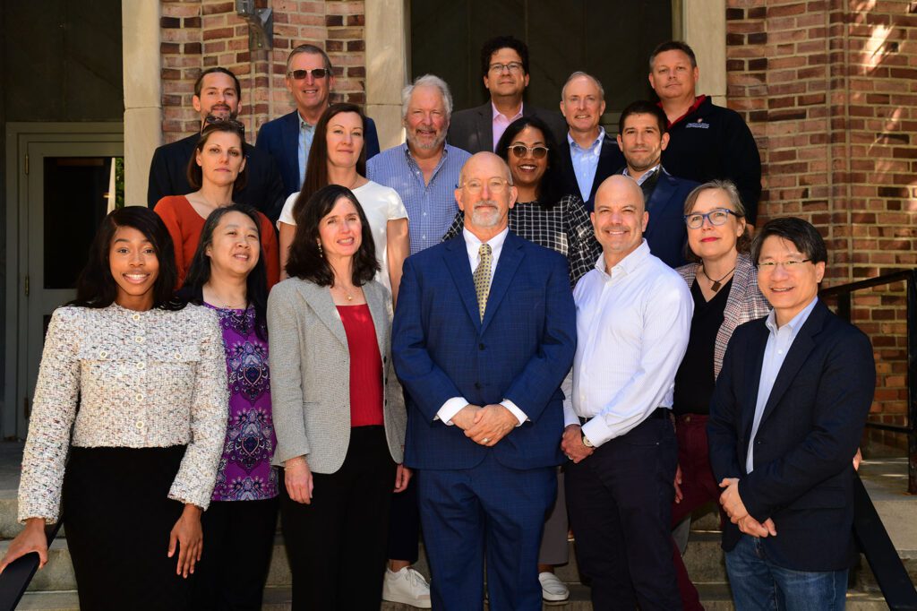 2025 advisory council standing together outside on the front steps of Olin Hall.