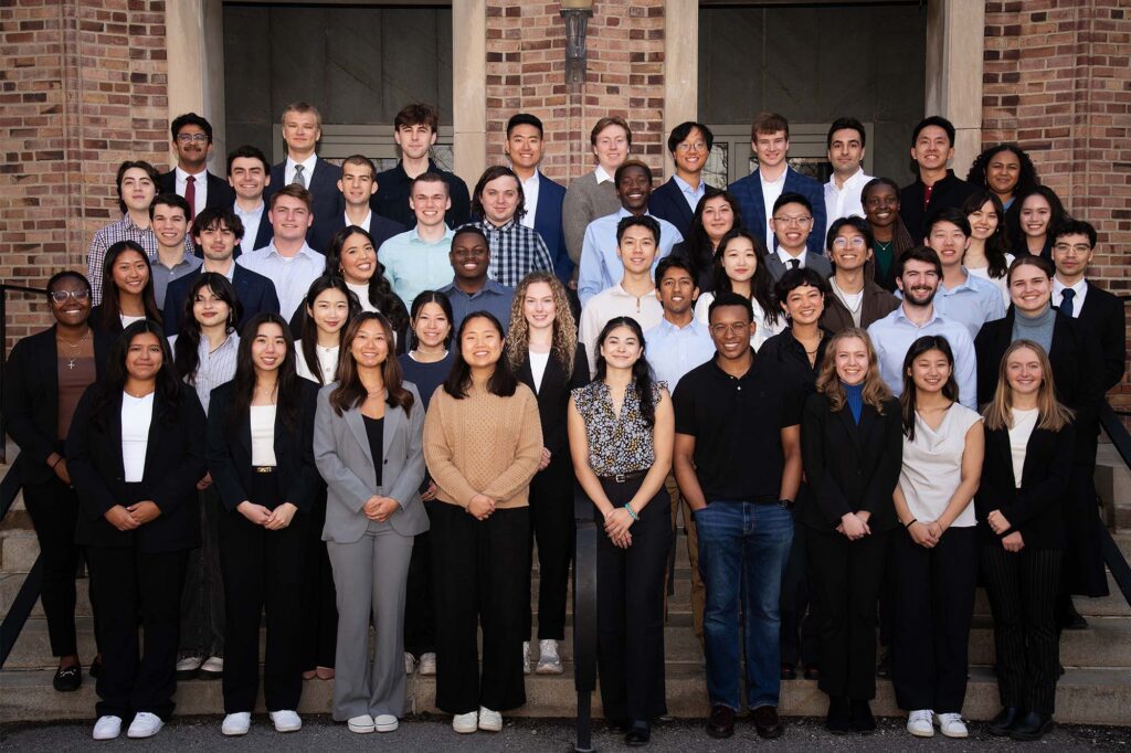 the undergraduate class of 2025 standing on front steps of Olin Hall.