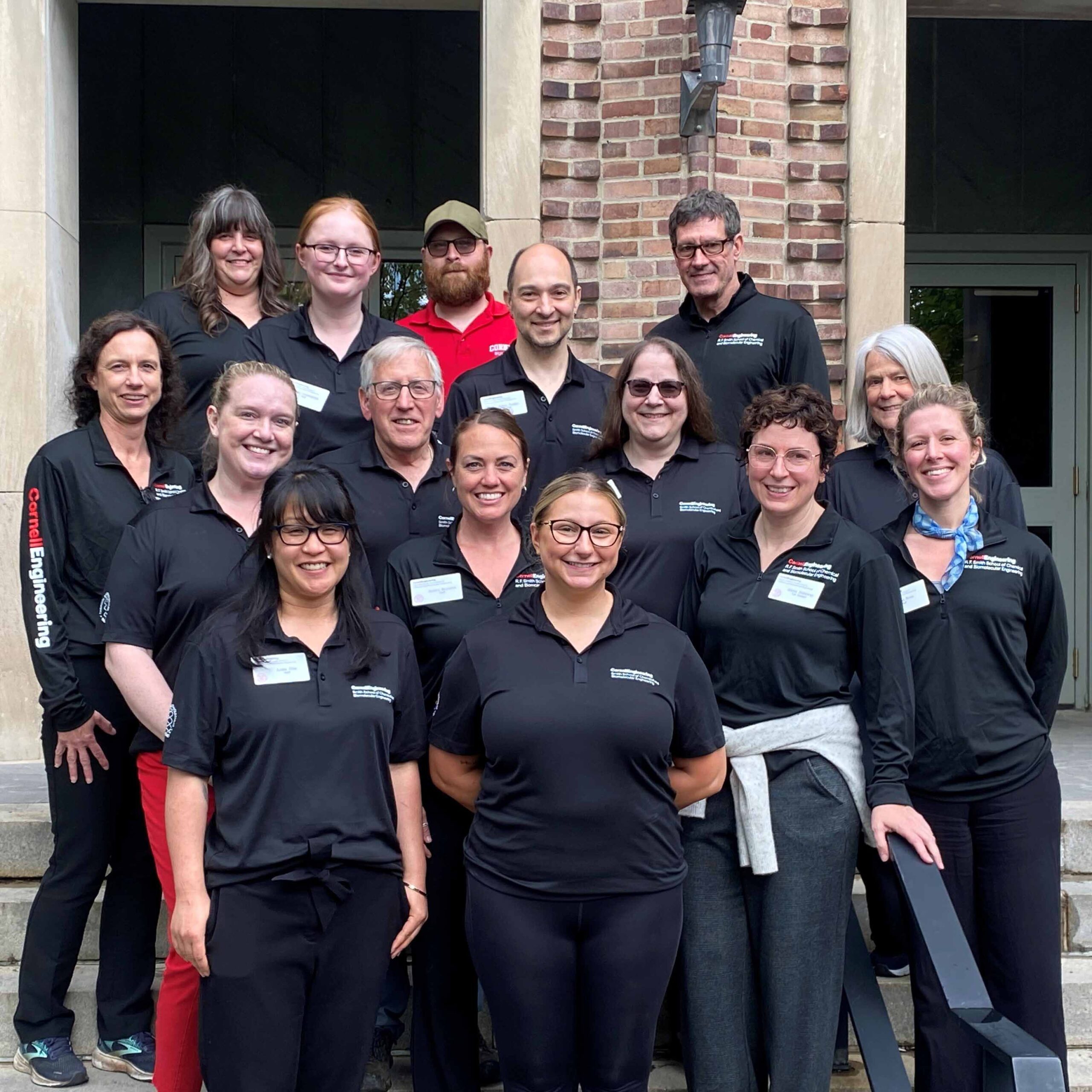 Staff standing together on front steps of Olin Hall