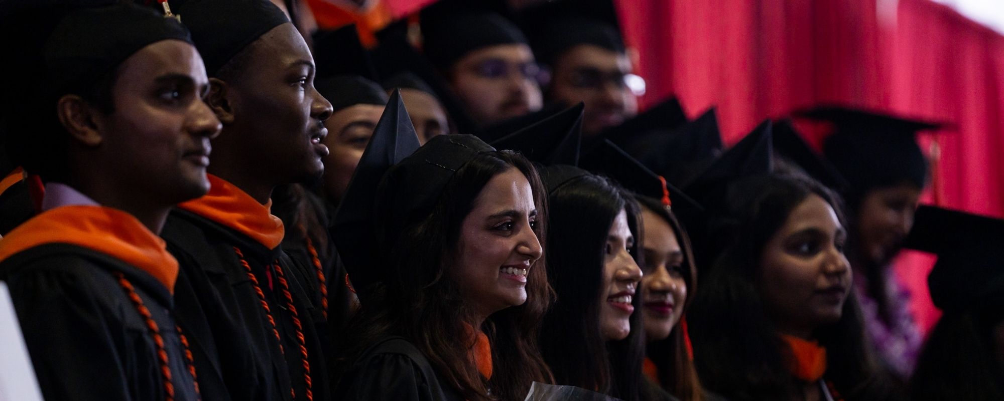 Students wearing caps and gowns during the 2024 graduation commencement ceremony for Cornell Engineering.