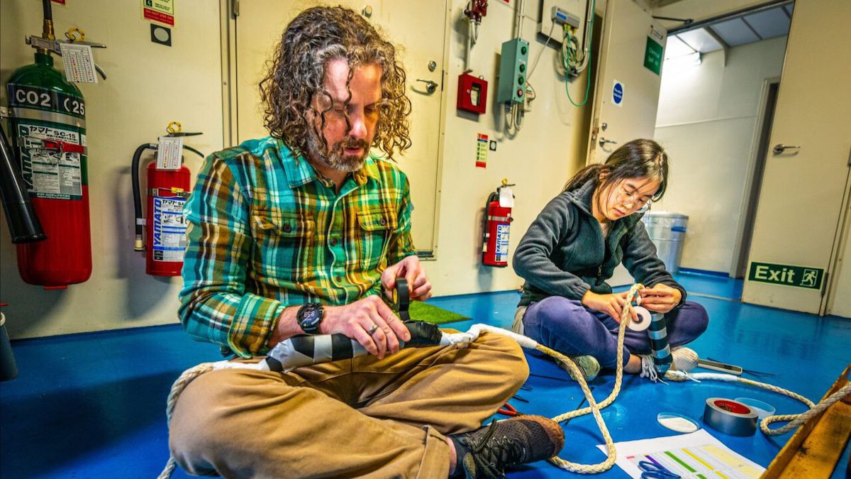 Professor Patrick Fulton tapes equipment used to study the plate boundary fault that ruptured during the Tohoku earthquake that devastated Japan in 2011.