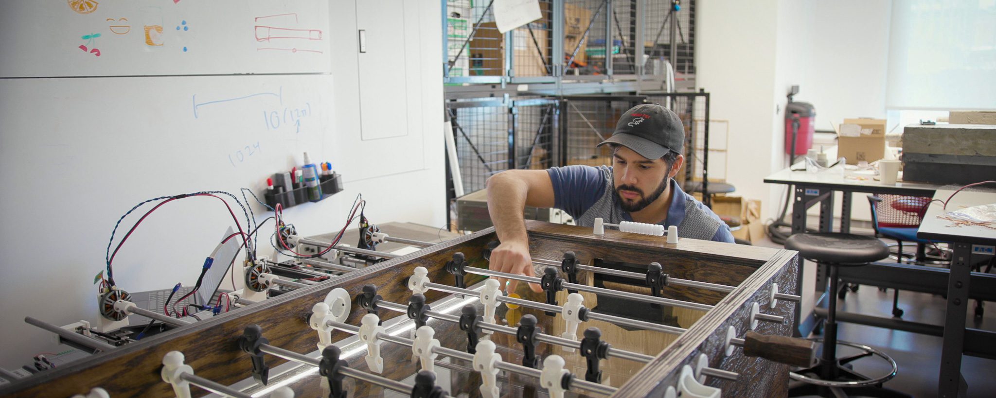 M.Eng. Student working in a Cornell lab with equipment