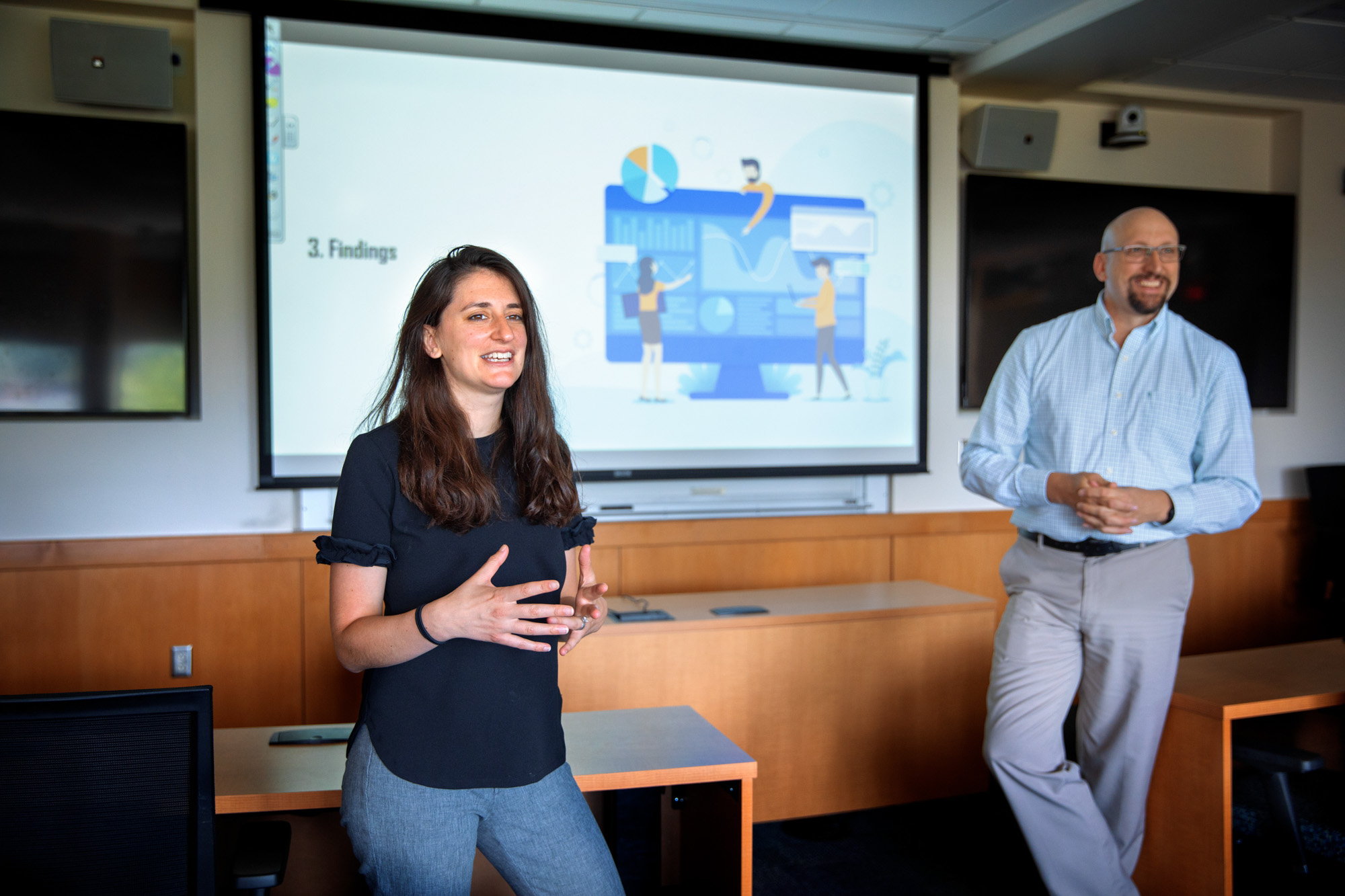 Engineering management executive director Andrea Ippolito and senior lecturer Robert Newman speaking in front of a classroom