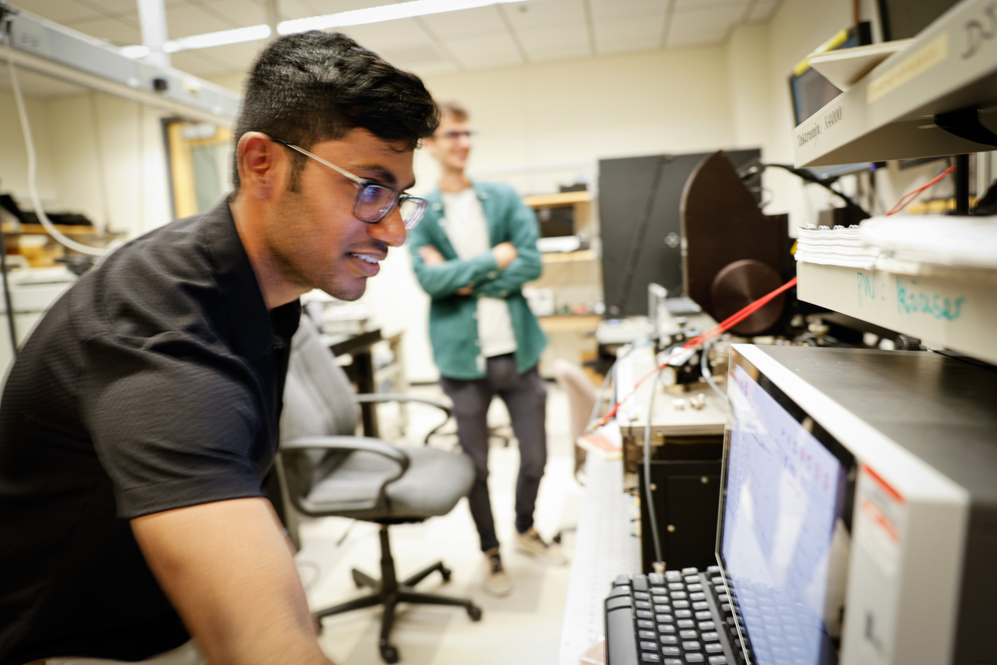 Two students working in Professor Grace Xing's lab