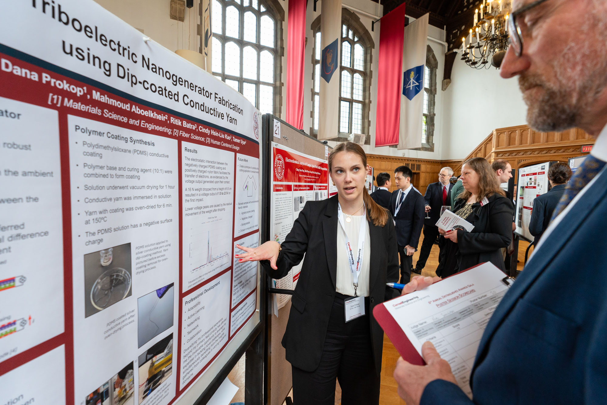 MSE student discussing their research poster during the distinguished awards gala