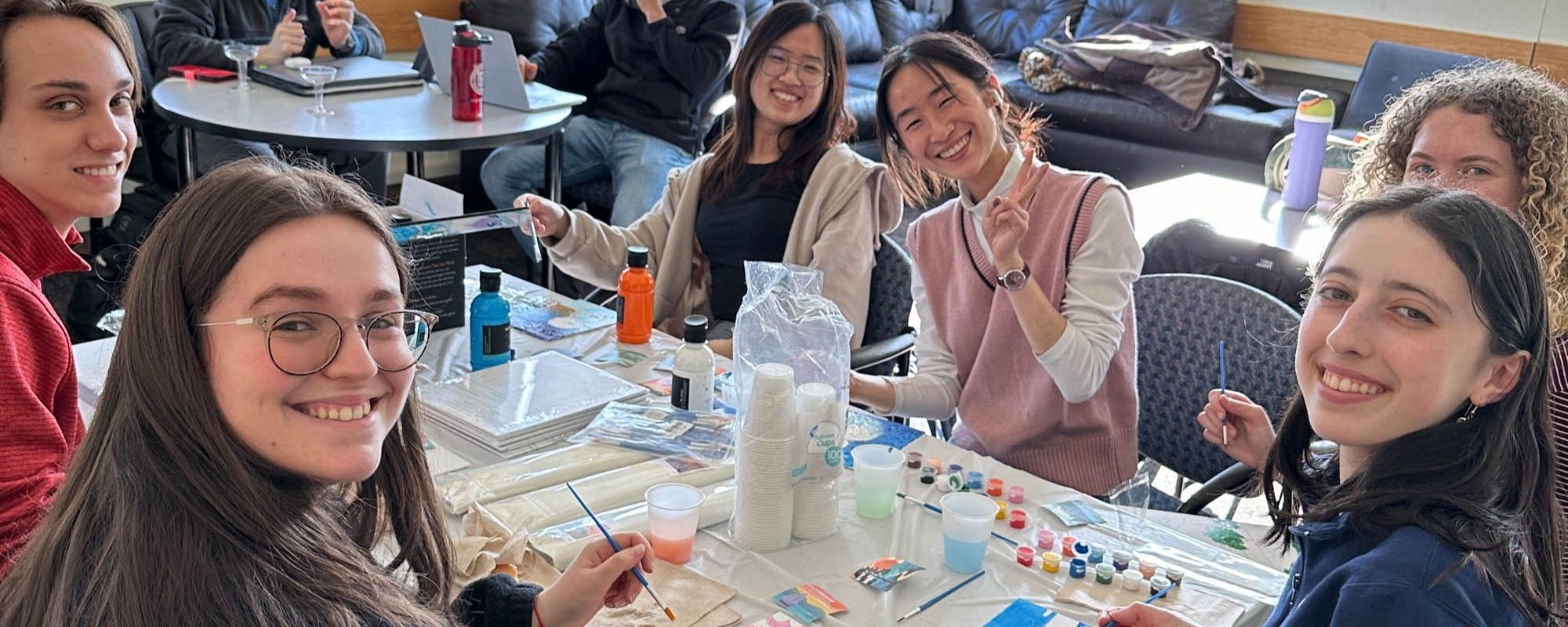 MSE students painting during a student happy hour in the department student lounge