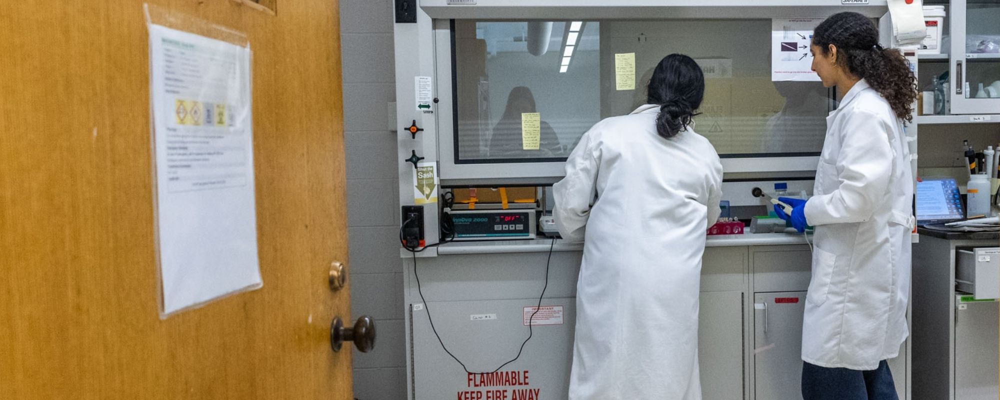 Zaina and Asher work together at the fume hood