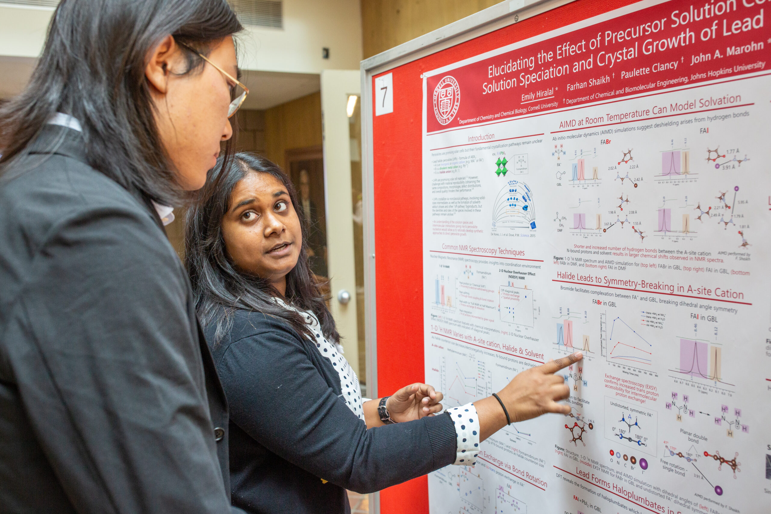 Students presenting during a poster session