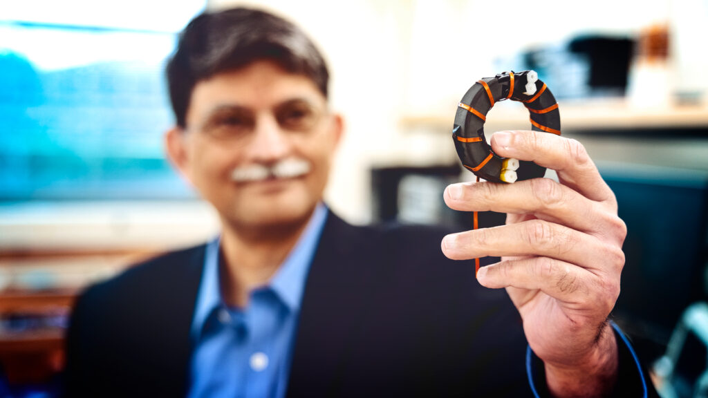 professor holds an inductor