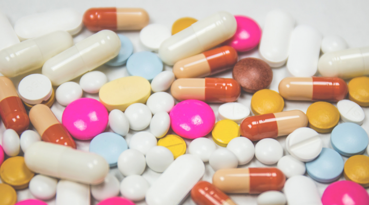 Multicolored pills. Photo by freestocks on Unsplash.