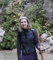 Cornell Earth and Atmospheric Sciences doctoral student Sara Miller fords a stream in Zion National Park.