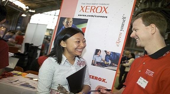 Student talking to employer at a career fair