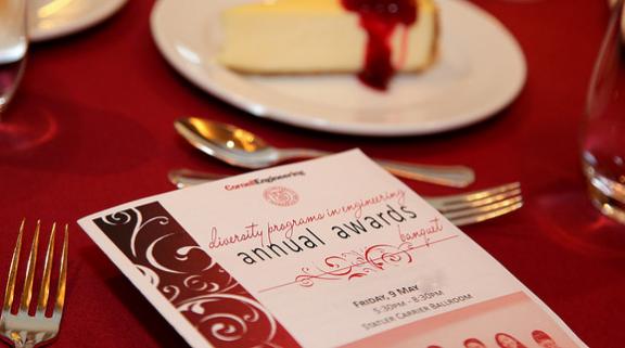 Awards Banquet program on a table with formal place setting