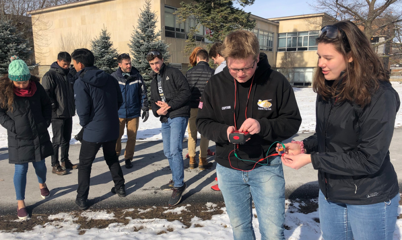 New Visions students test their berry-powered solar cells on the engineering quad