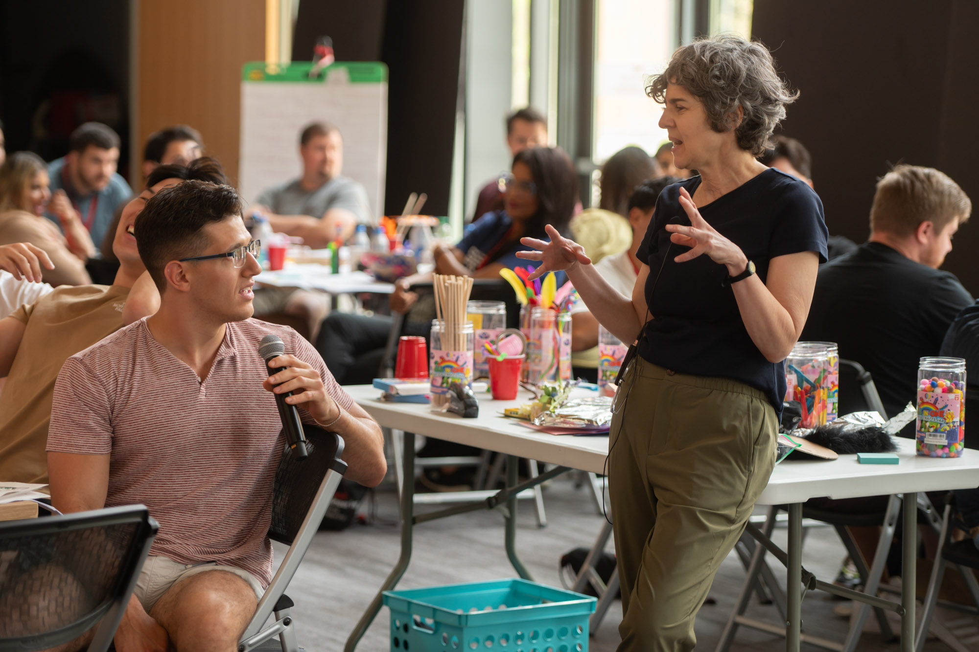 Lecturer Sirietta Simoncini answers a question from a SYSEN 5940 student while other students work on their projects