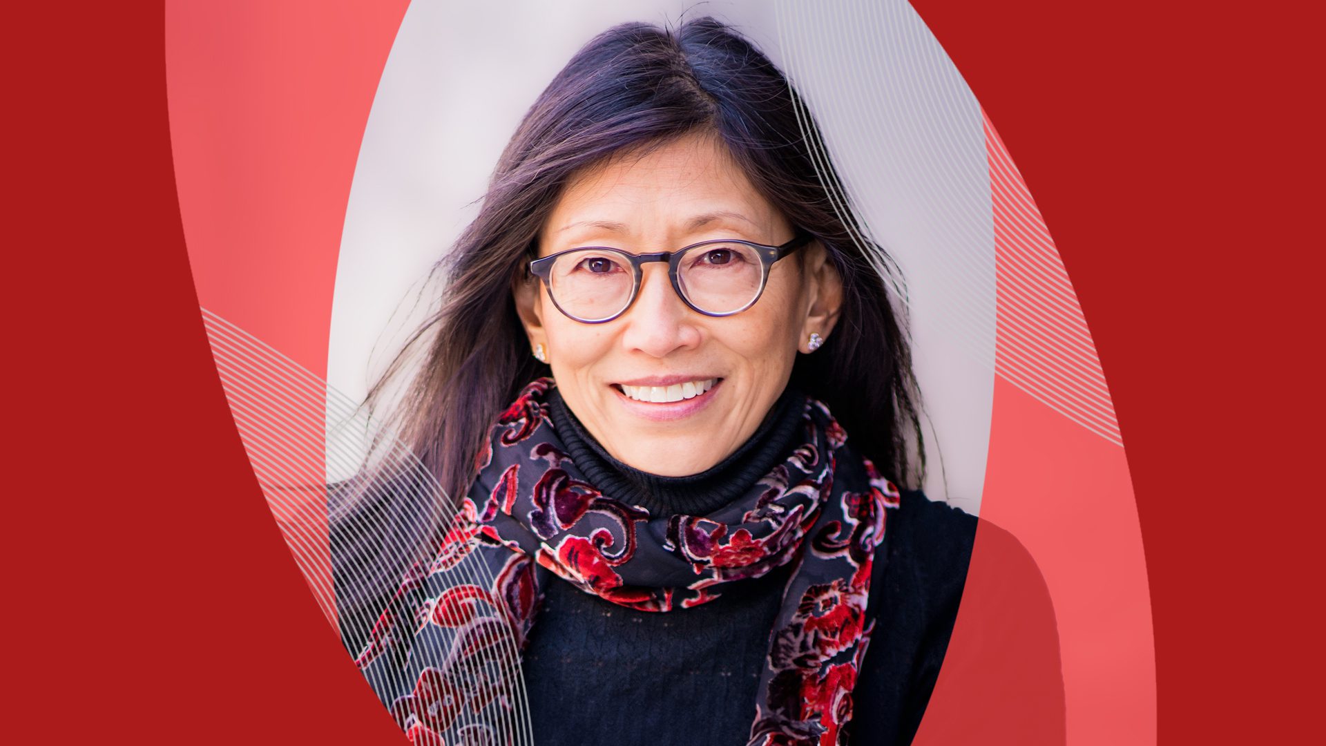 Molly Tschang '85 headshot with red background