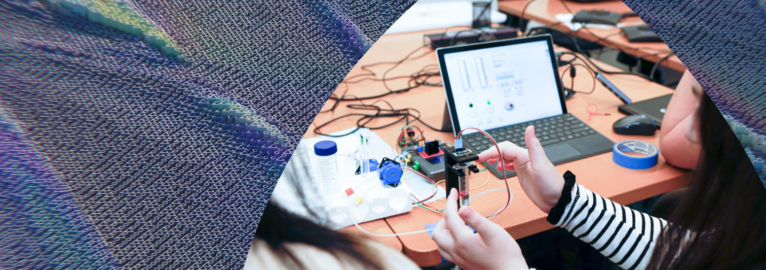 A student works with wires and computer software
