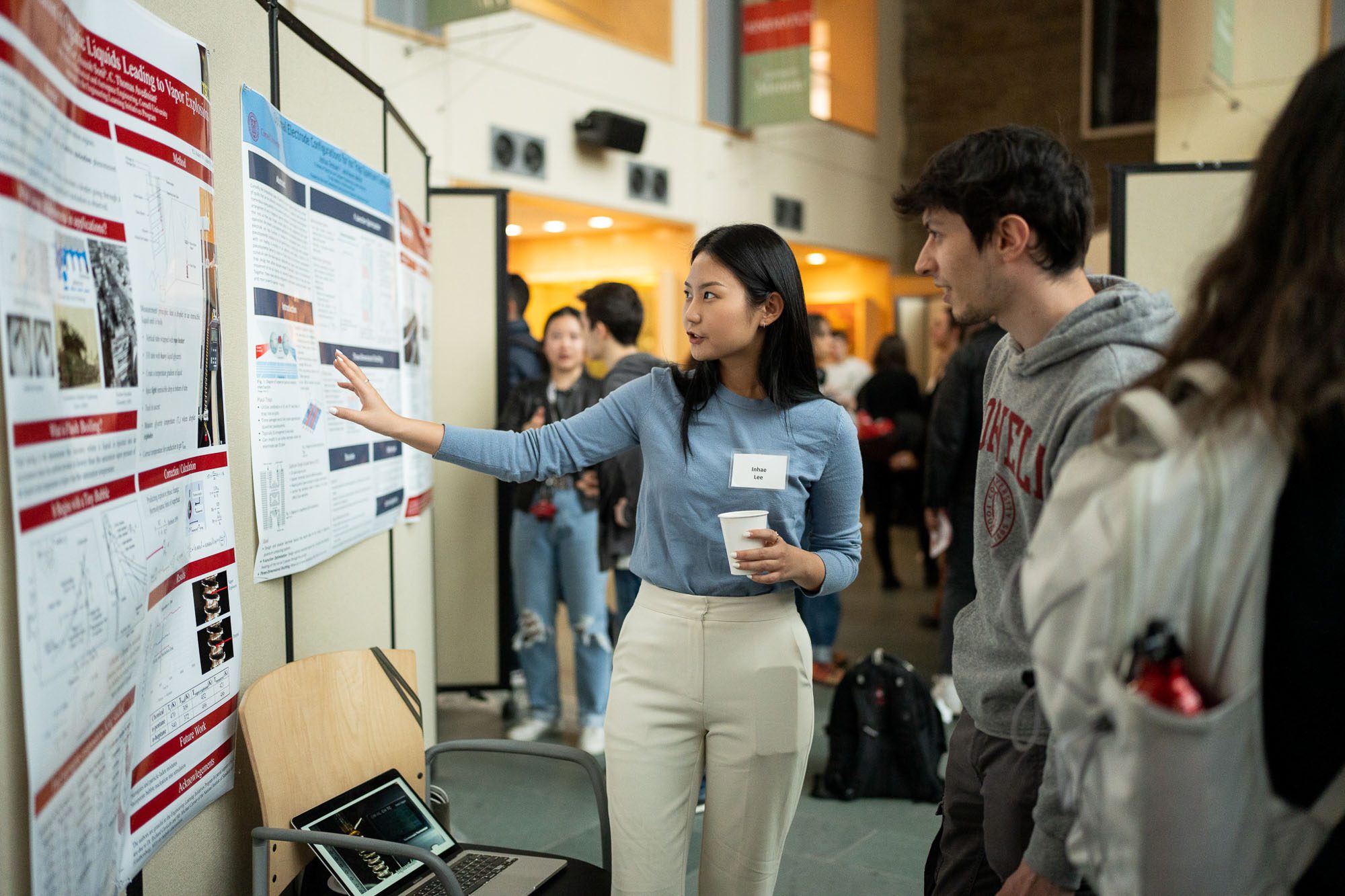 Inhae Lee presents her research at a poster session