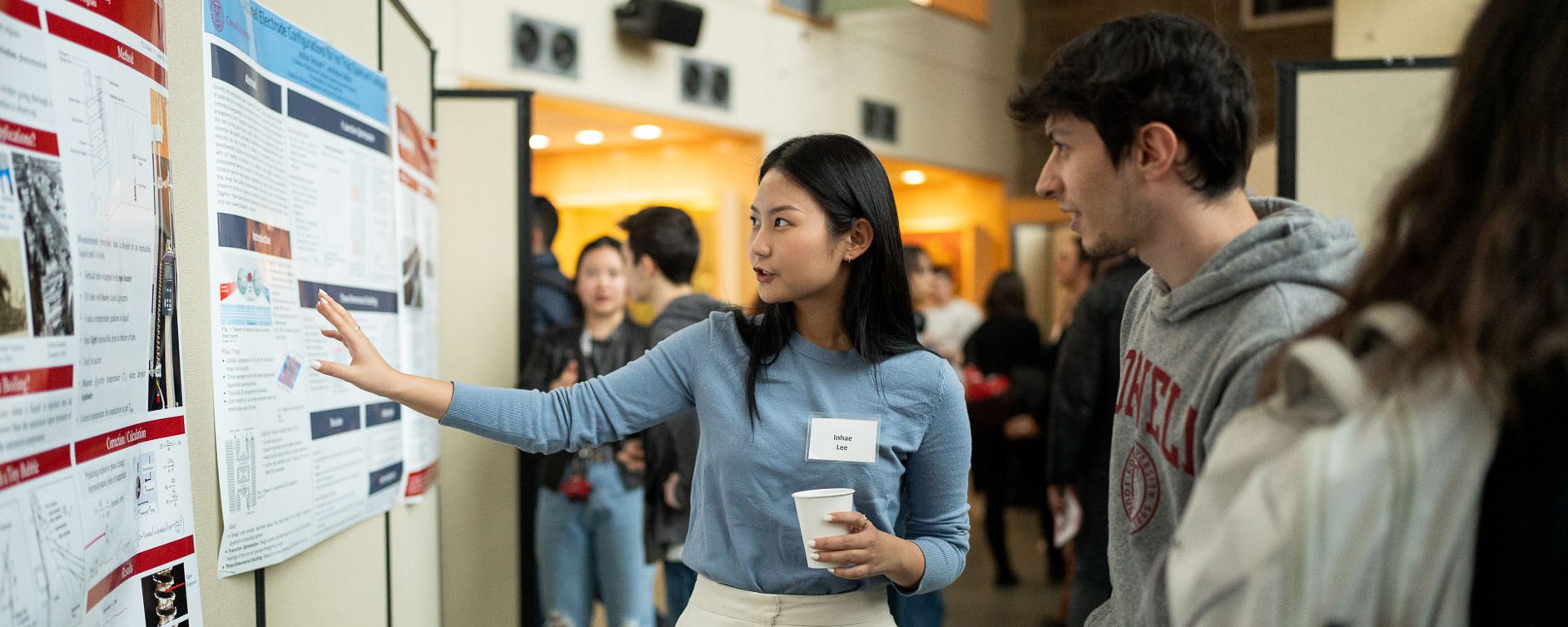Undergraduate Student Inhae Lee presents her research at a poster session