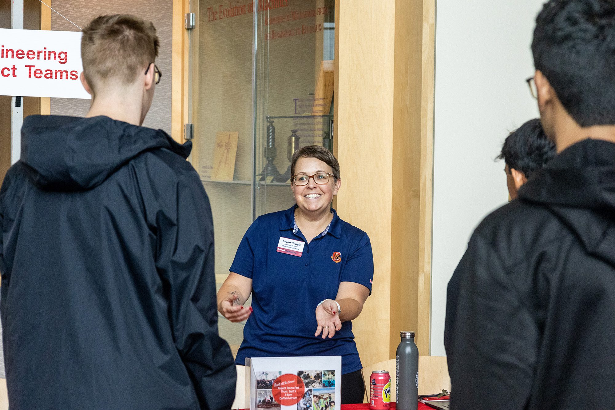 Project Teams Director Lauren Stulgis speaks with students during a welcome event