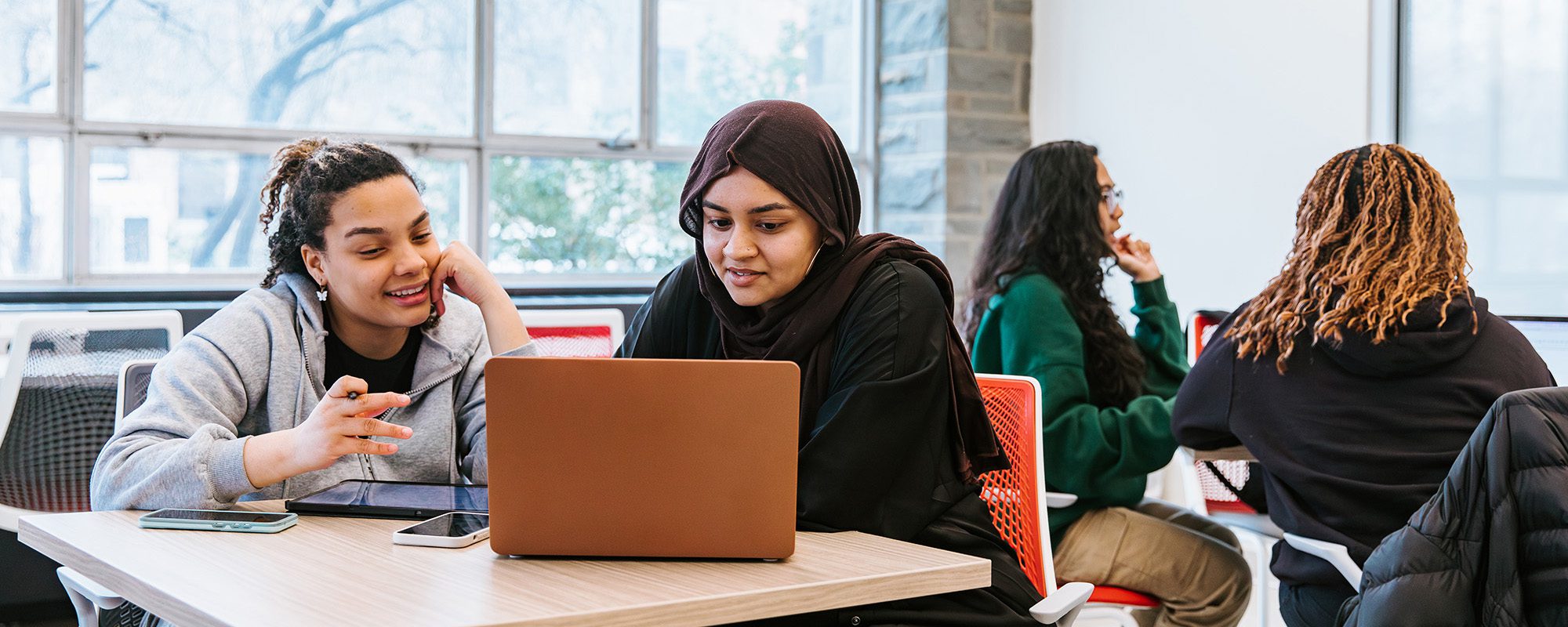 Students gather in the Office of Inclusive Excellence Hub