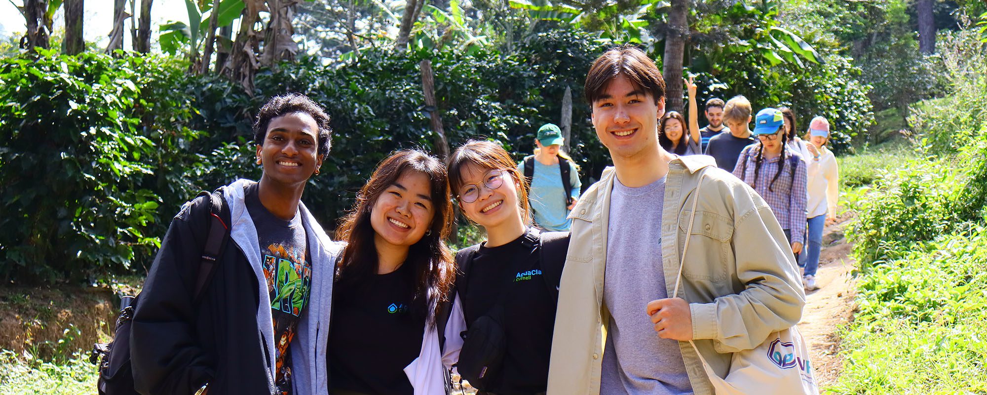 4 students smile for a photo while on a trip to Honduras for Agua Clara