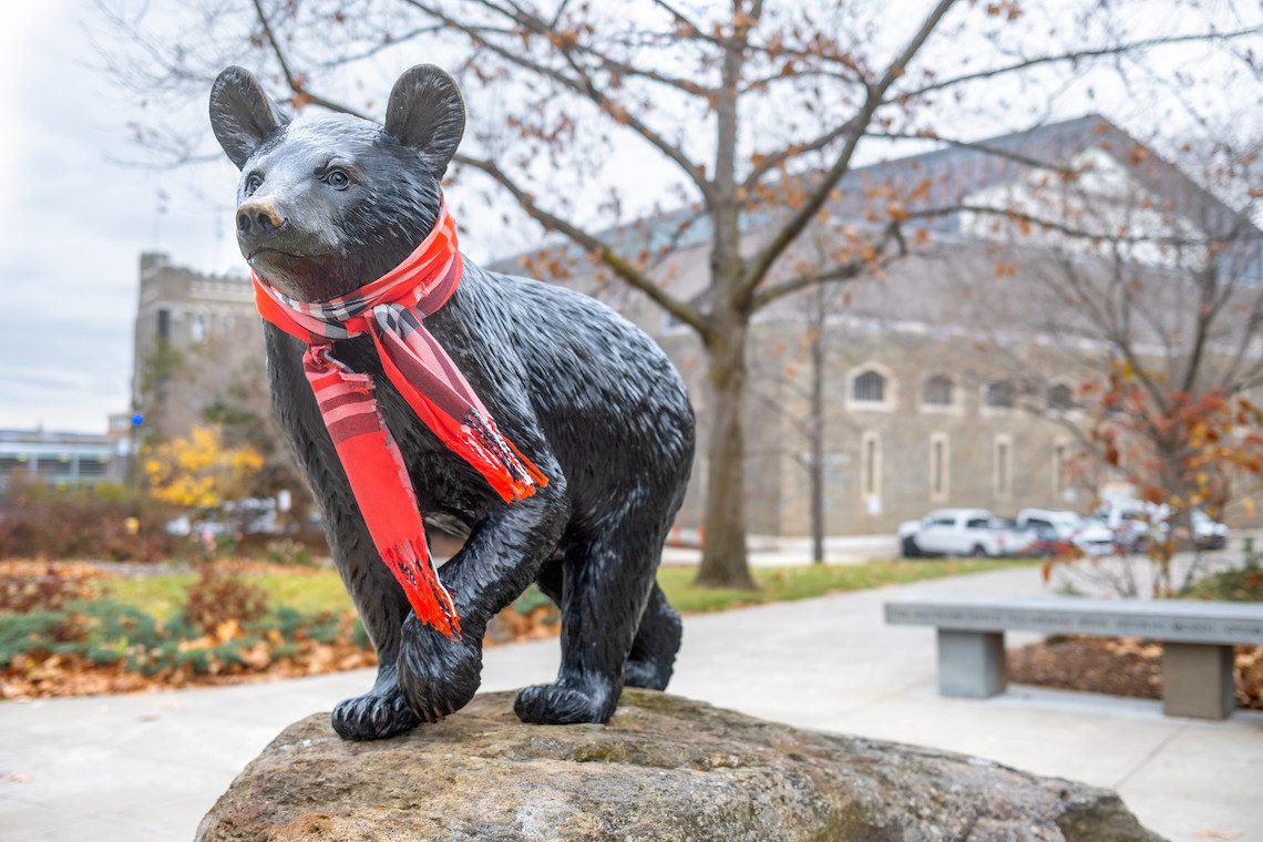 touchdown statue with a scarf around its neck